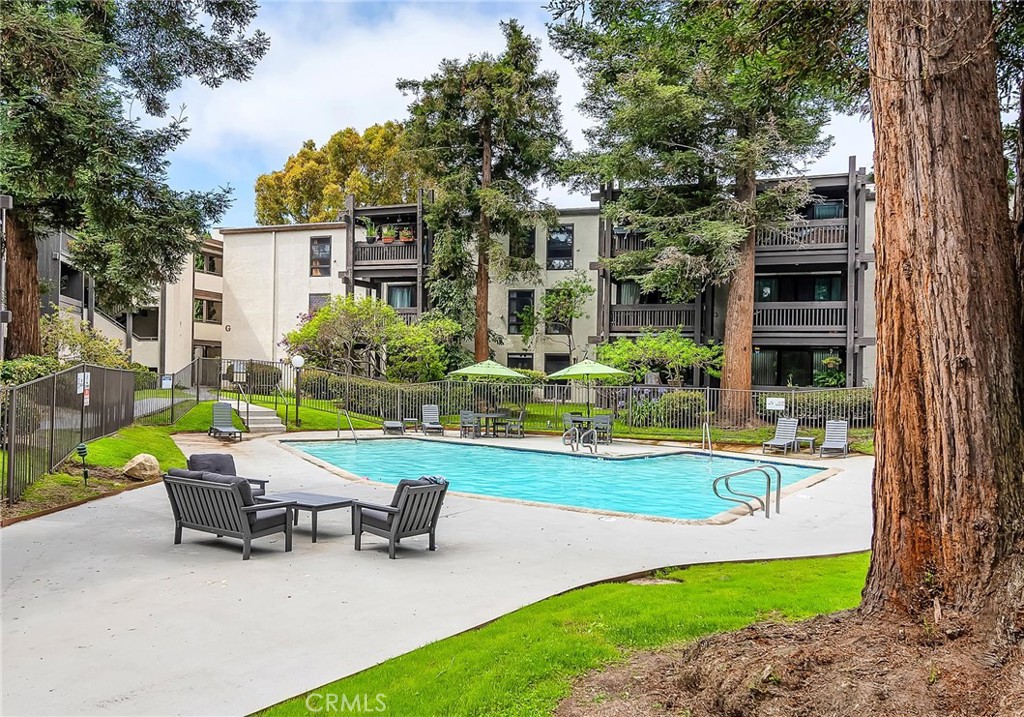 a view of a house with backyard sitting area and garden