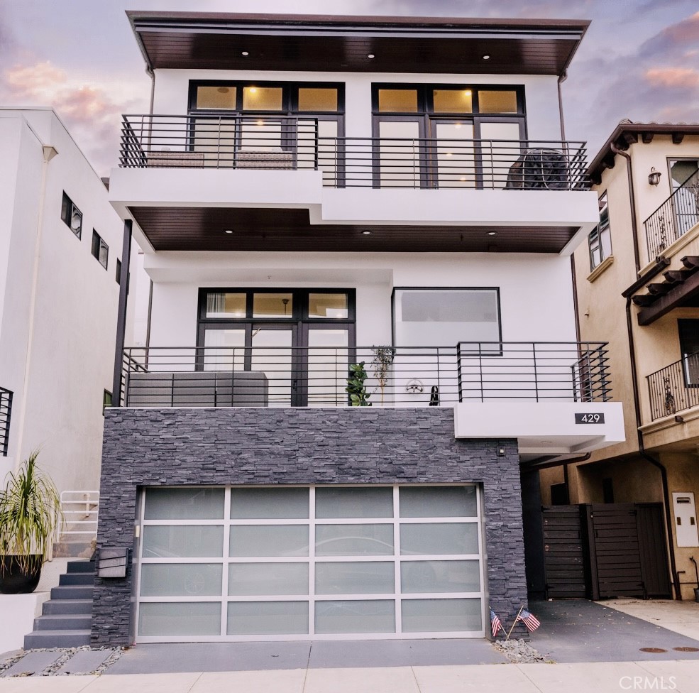 a front view of a house with a garage