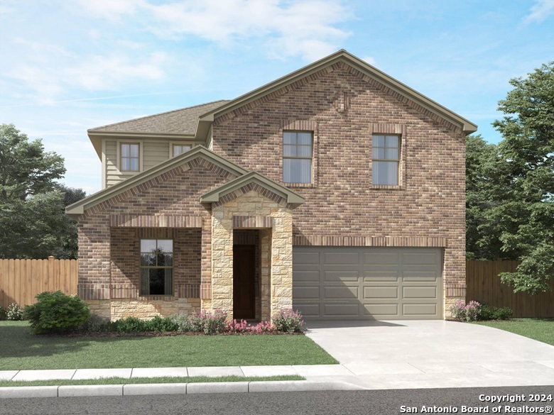 a front view of a house with garage and garage