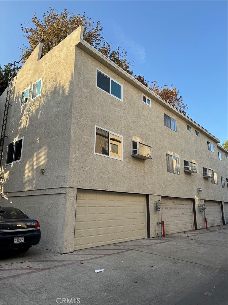 a front view of a house with parking area