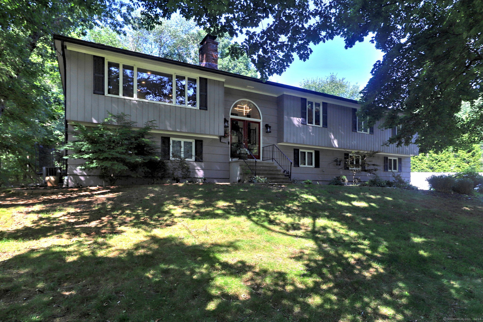 a front view of a house with swimming pool