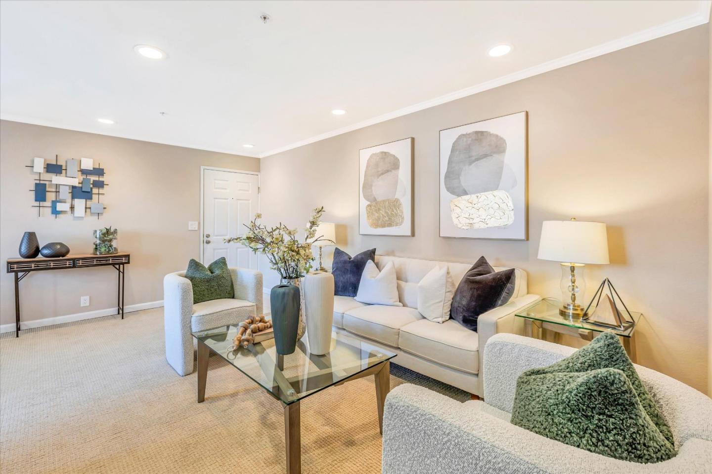 a living room with furniture and a potted plant