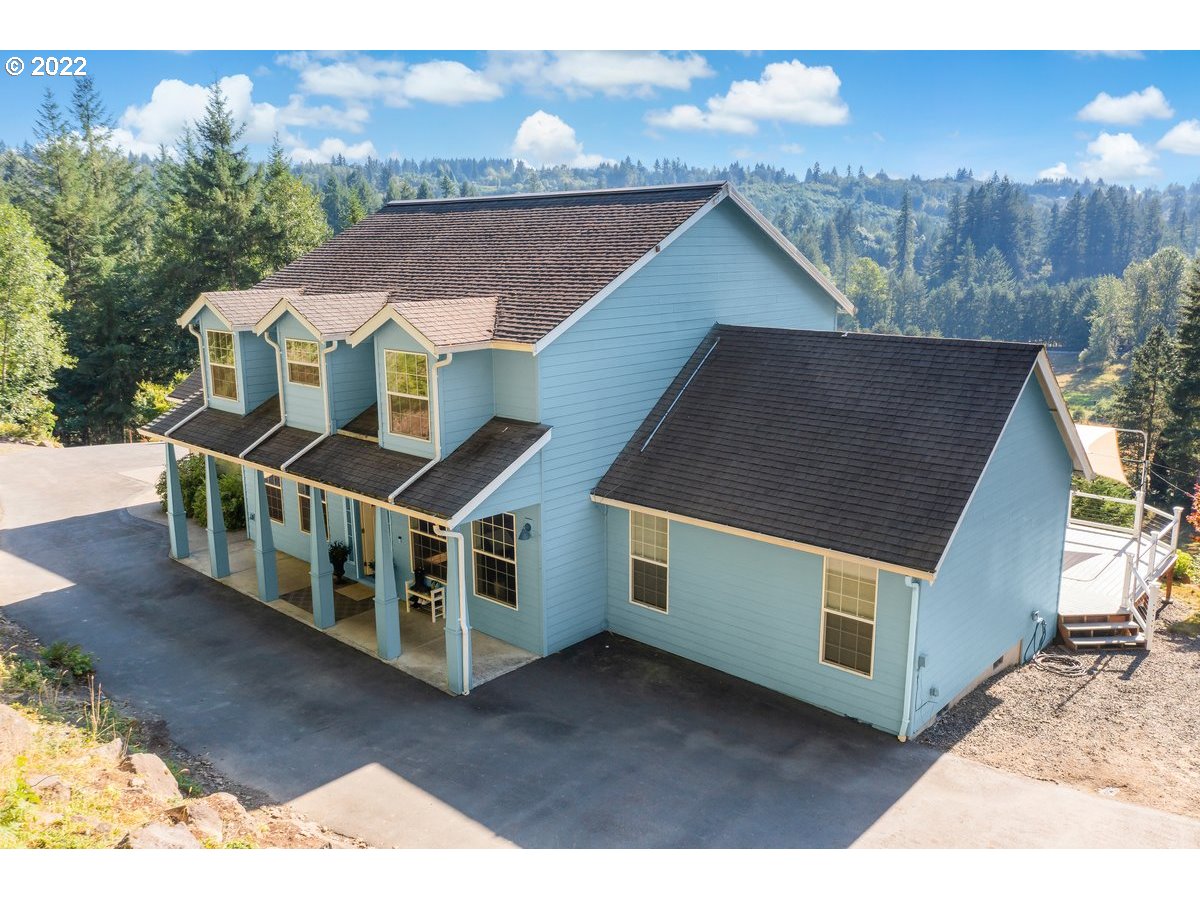 a aerial view of a house with a yard