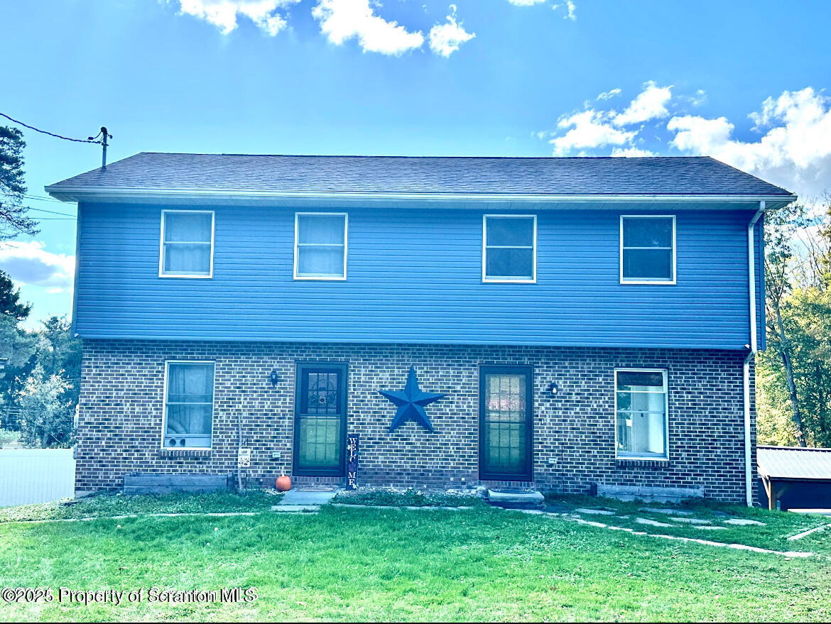 front view of a house with a yard