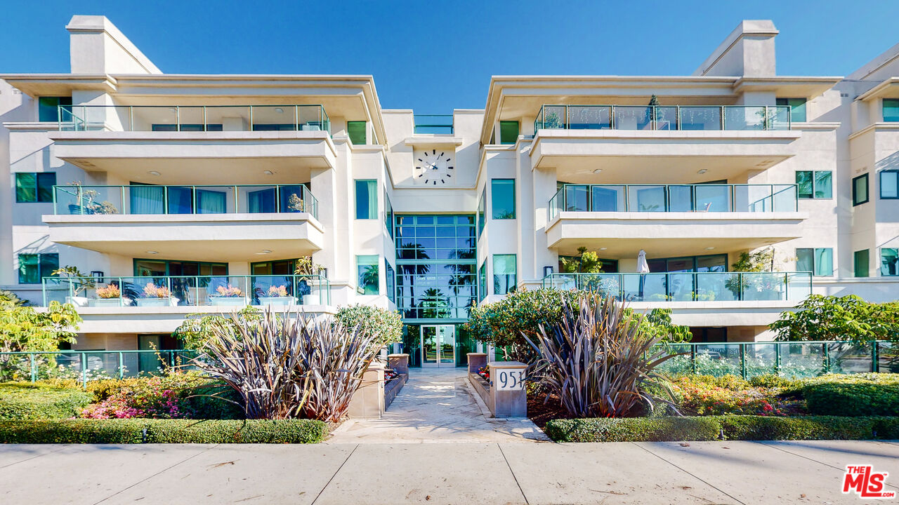 a front view of a building with garden