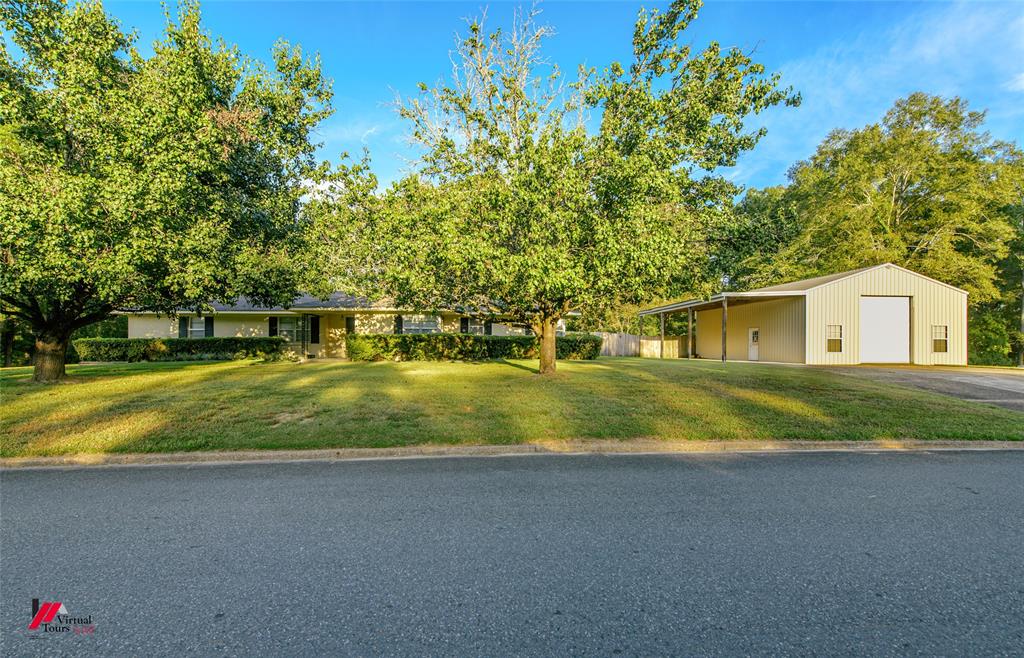 a view of house with trees in the background