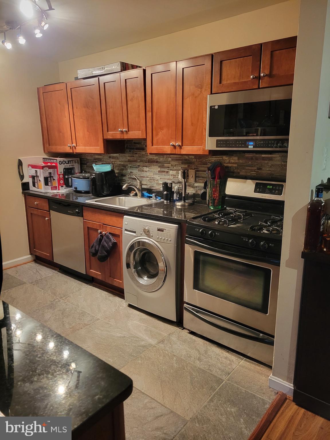 a kitchen with a stove and a microwave