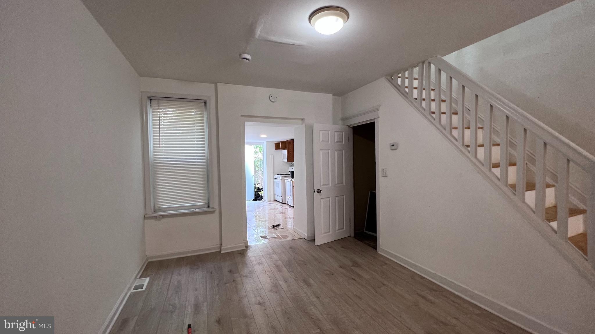 wooden floor in an empty room with a gallery