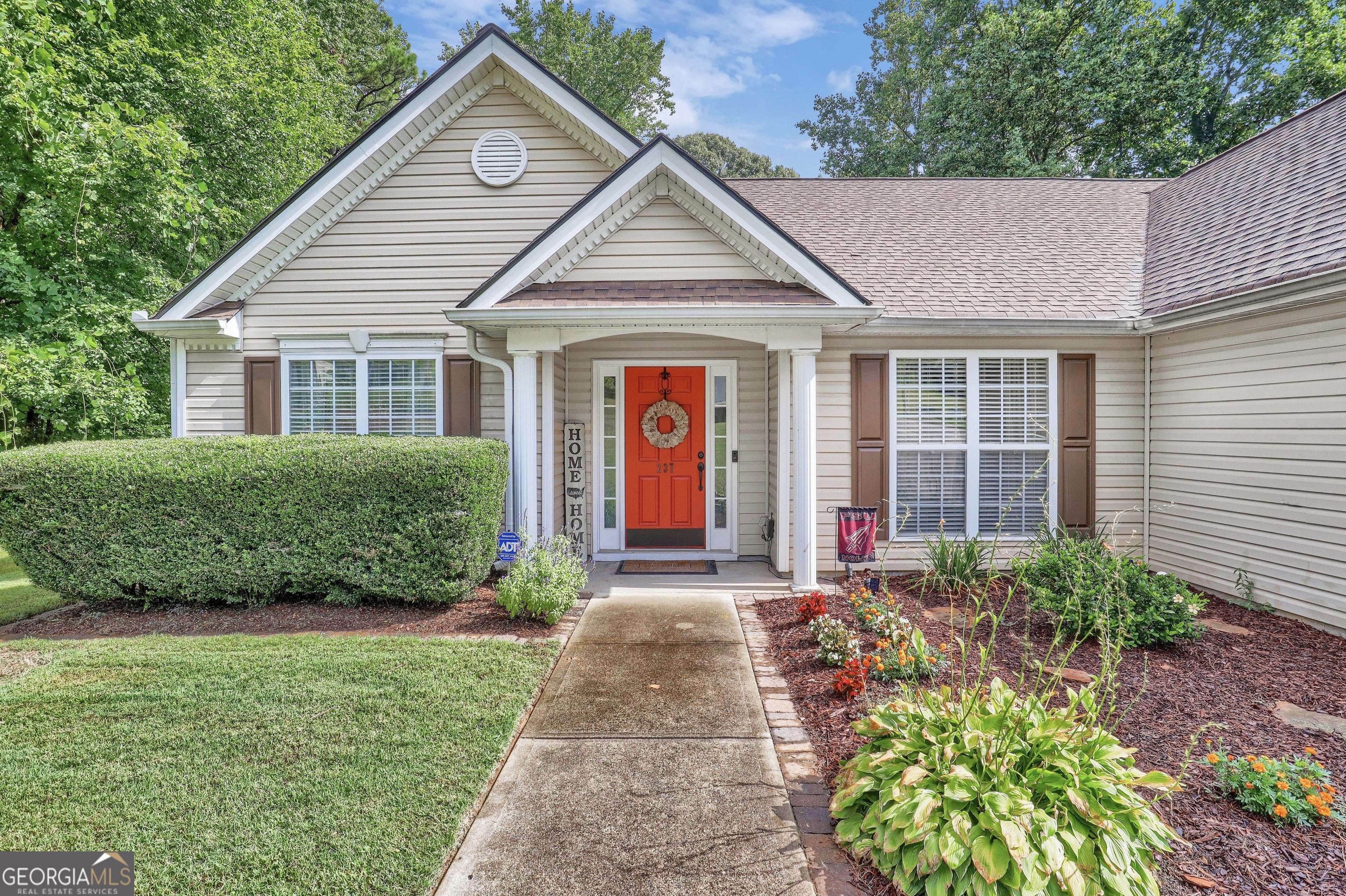 a front view of a house with a yard