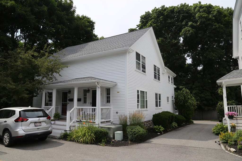 a view of a car parked in front of a house