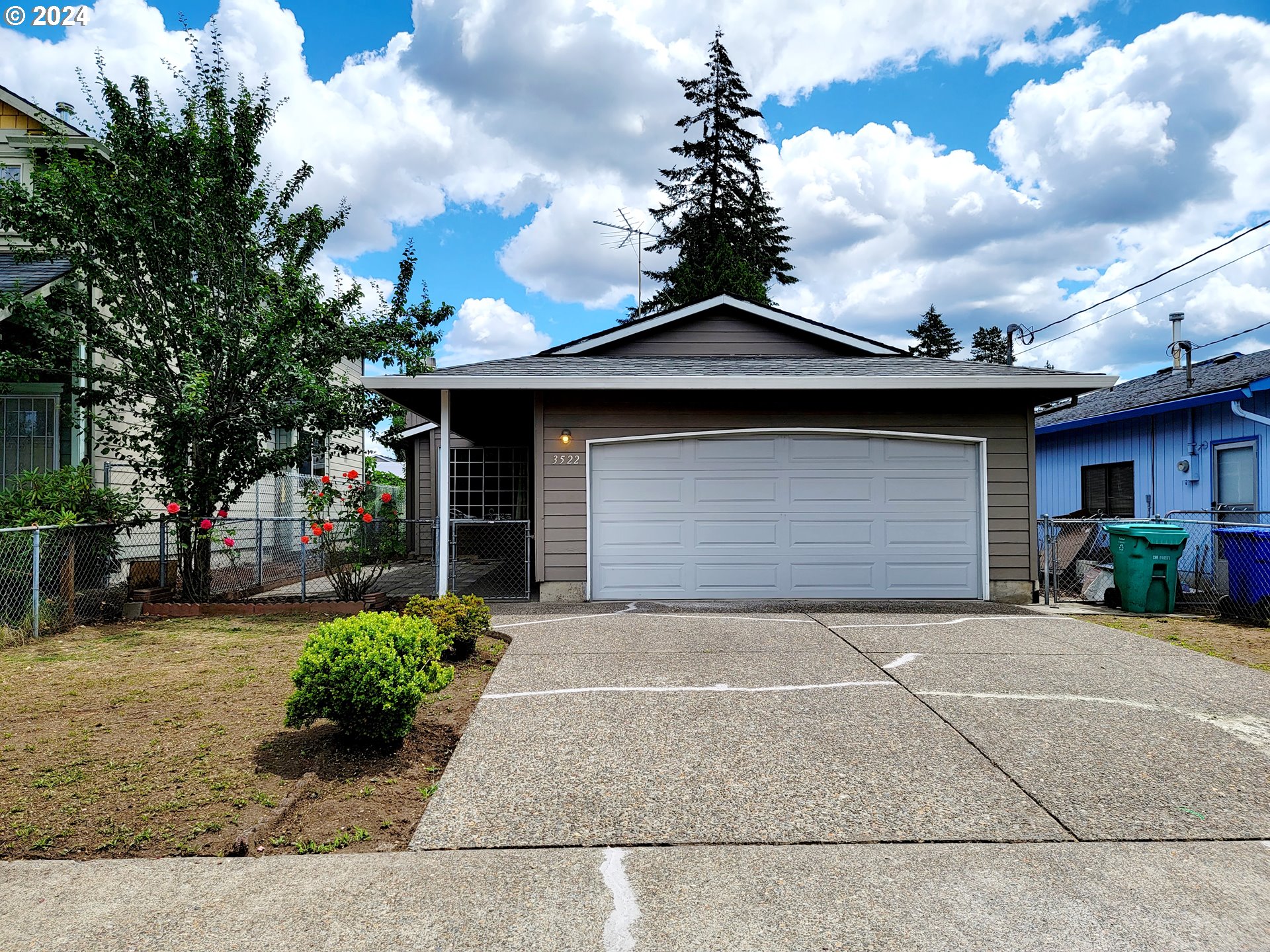 a front view of a house with garden