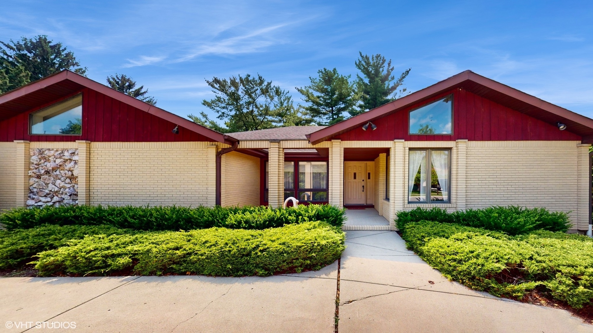 a front view of house with yard and green space