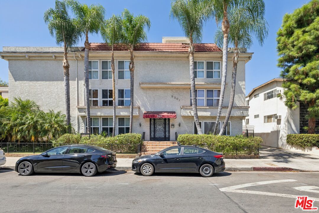 front view of a car parked in front of a house