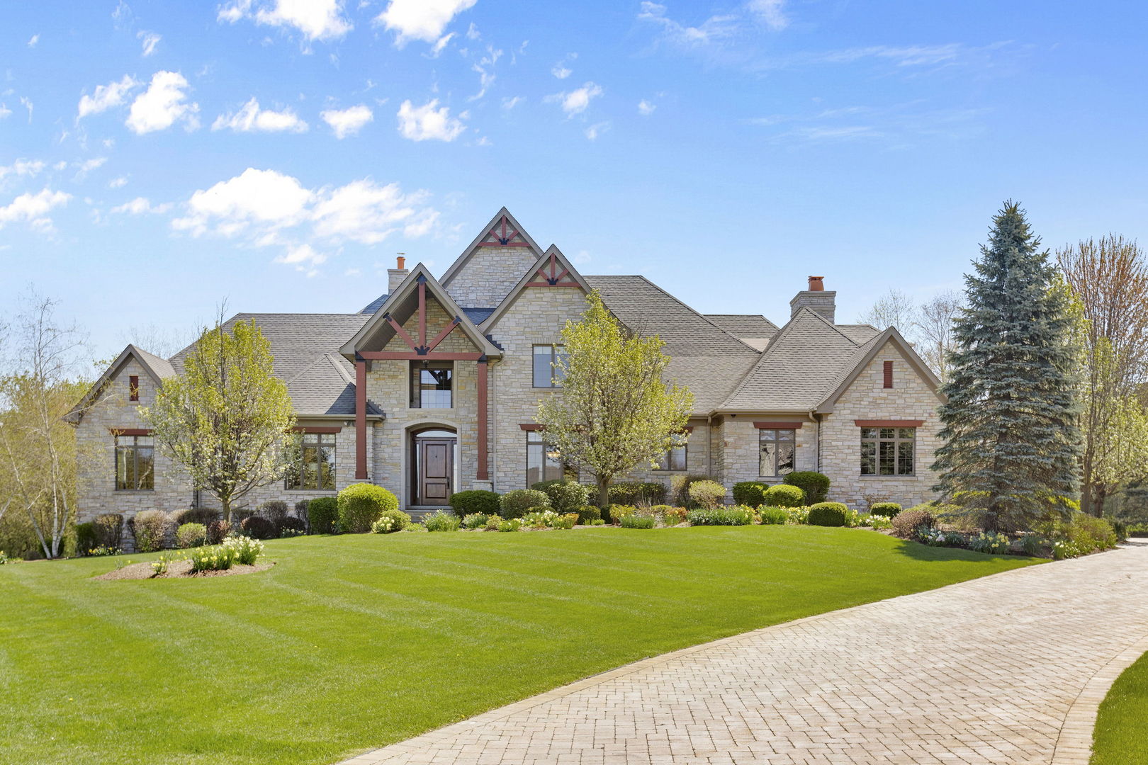 a front view of house with yard and green space