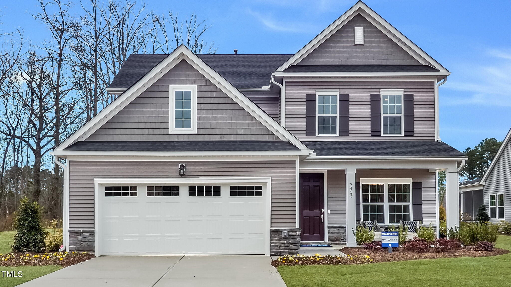 front view of a house with a yard