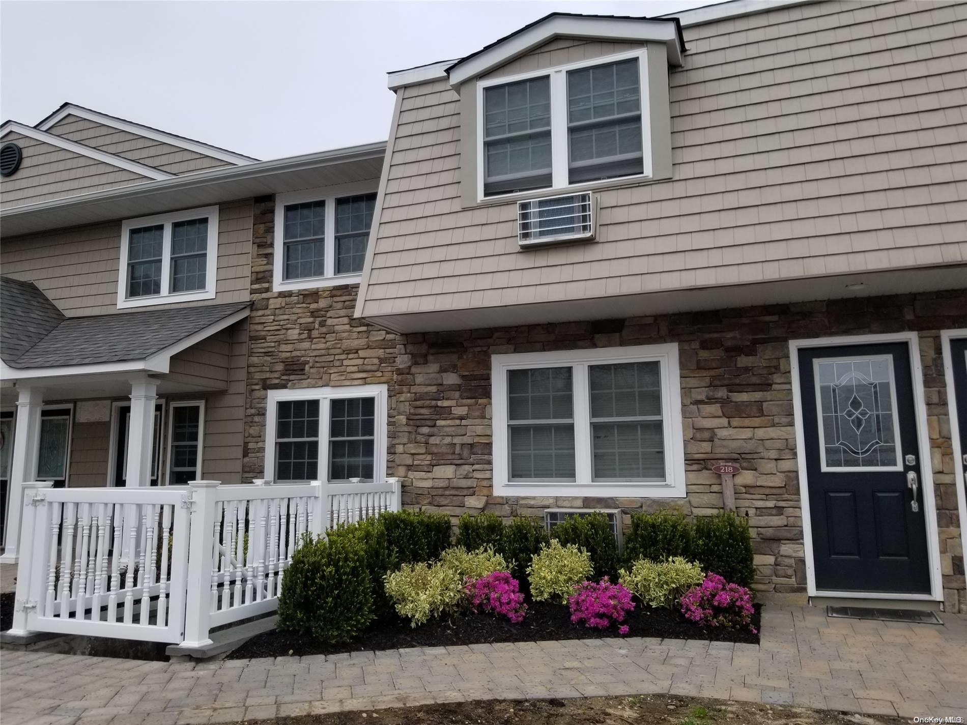 a front view of a house with a outdoor space