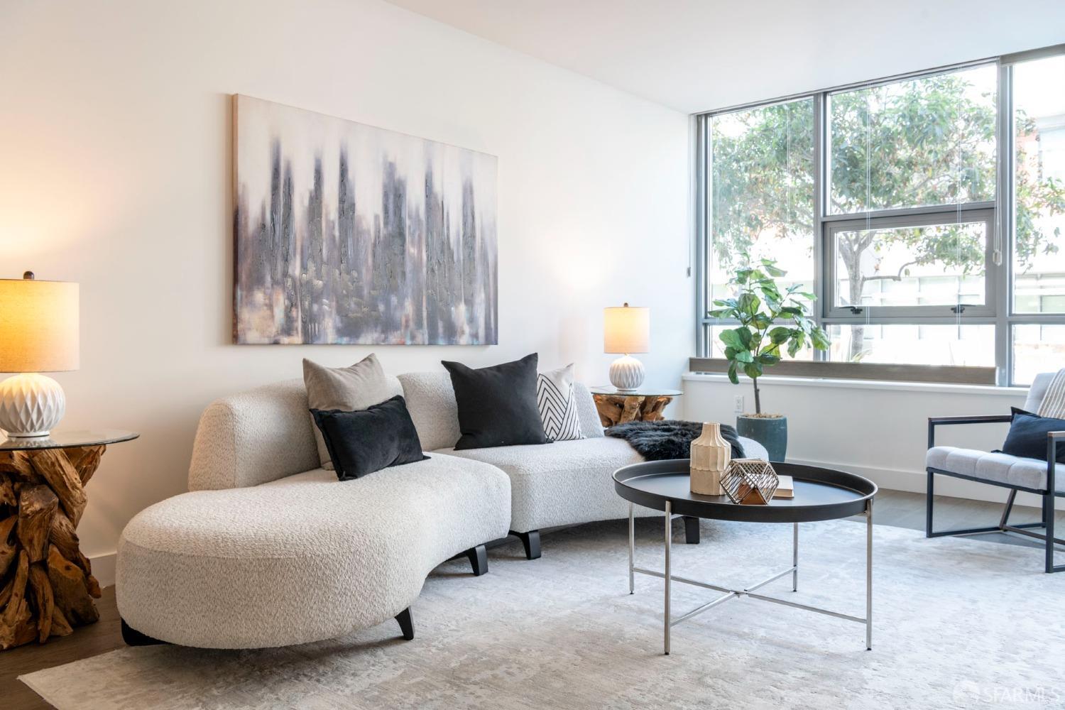 a living room with furniture and a large window