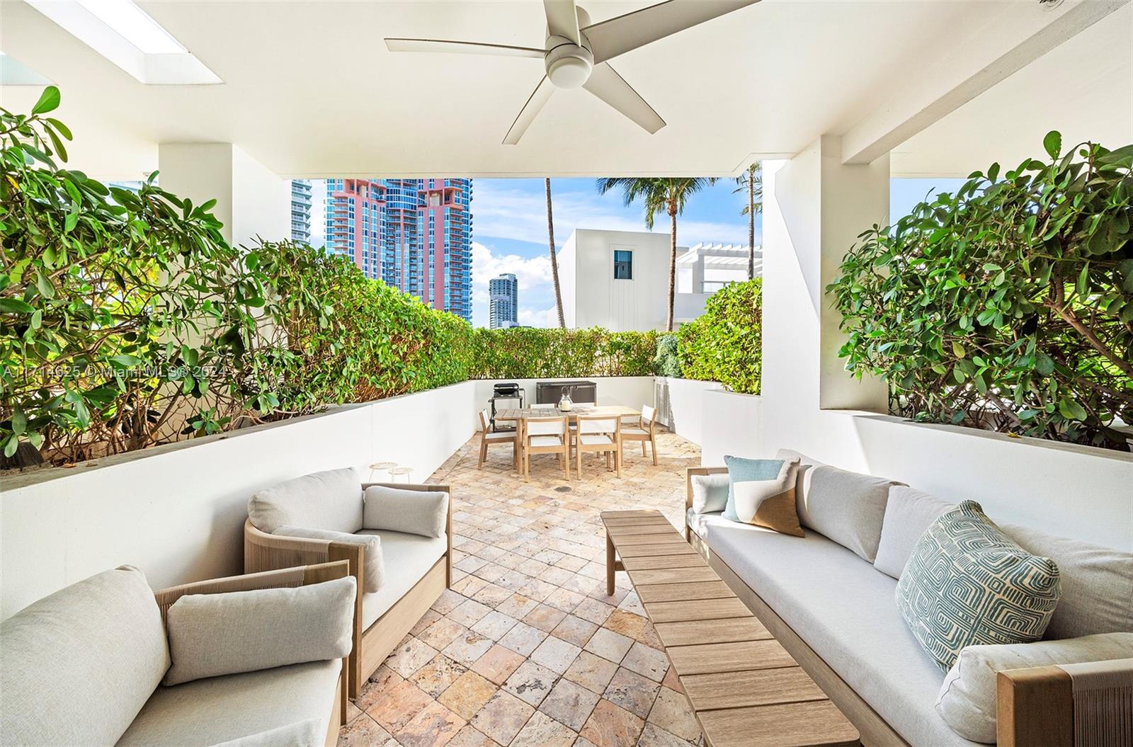 a outdoor living space with furniture and a potted plant