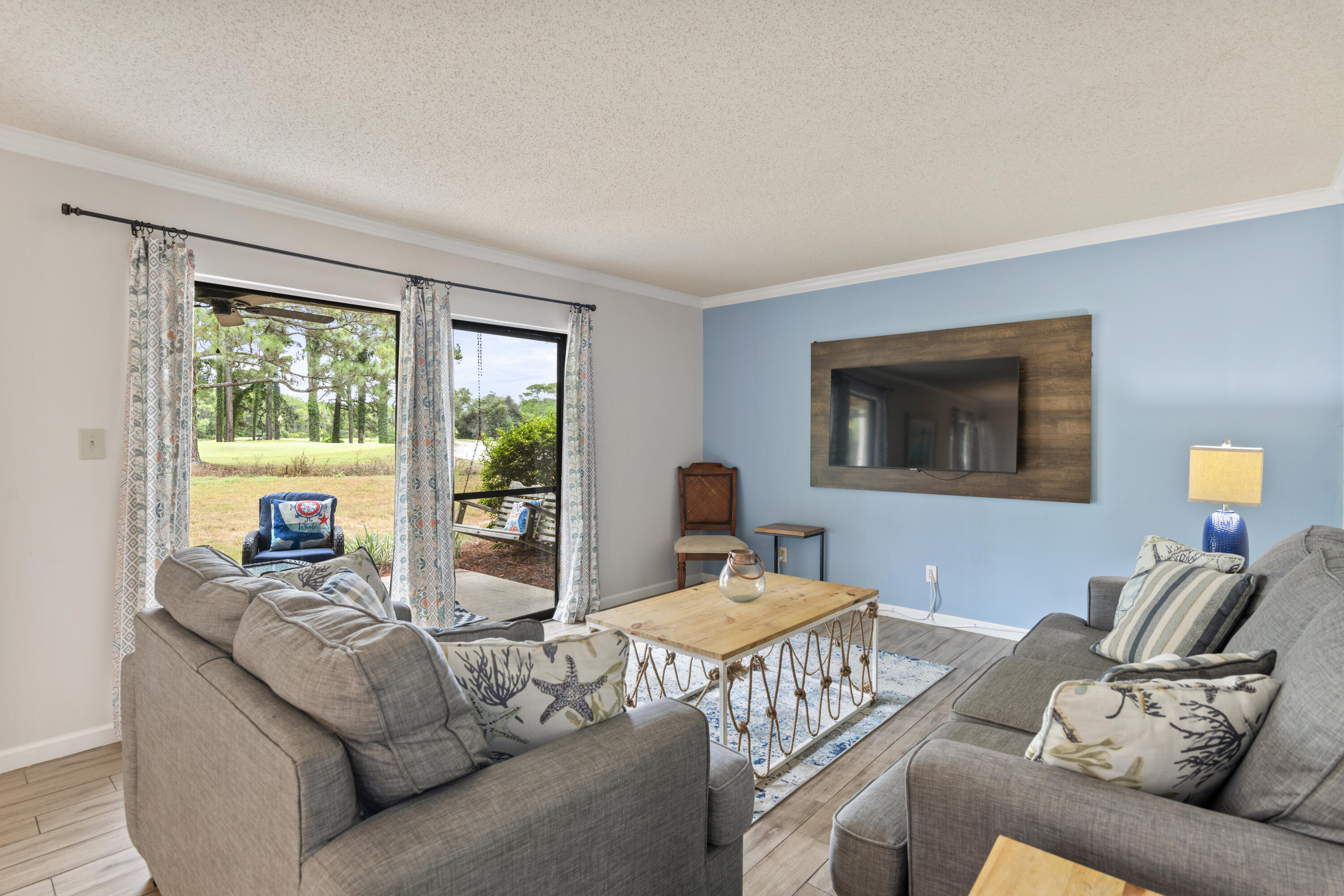 a living room with furniture and a window