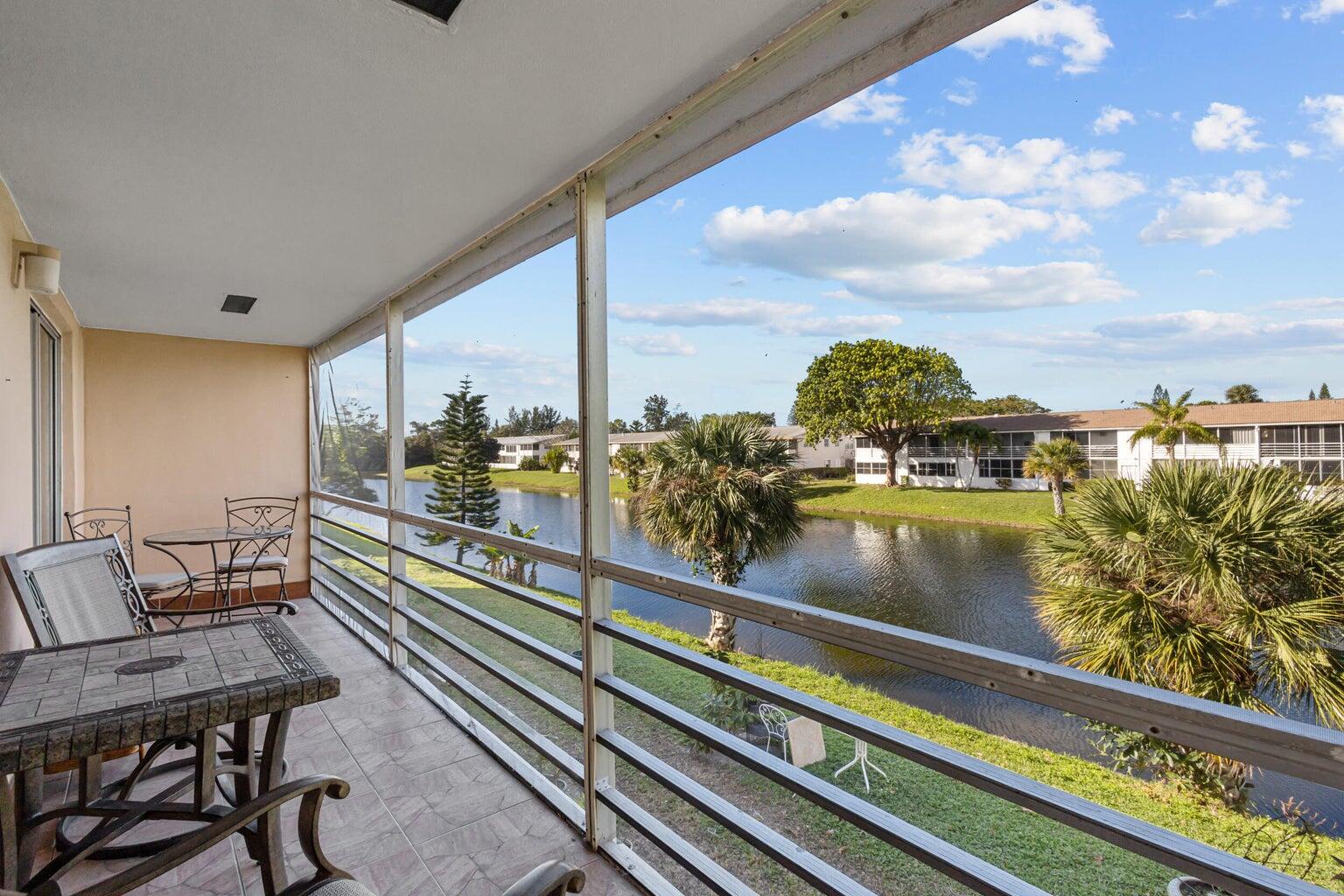 a view of a balcony with chairs