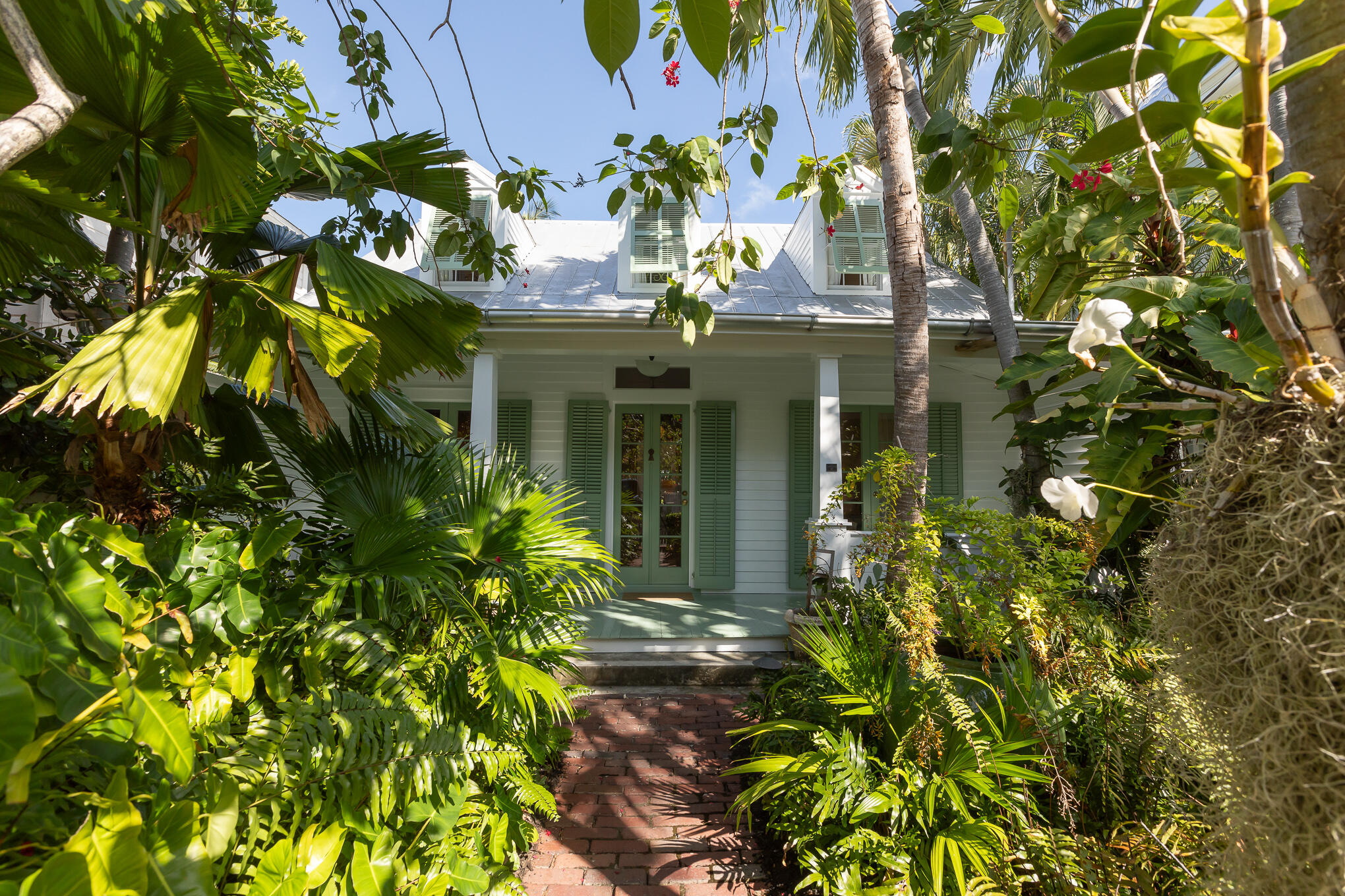 a view of a house with a tree