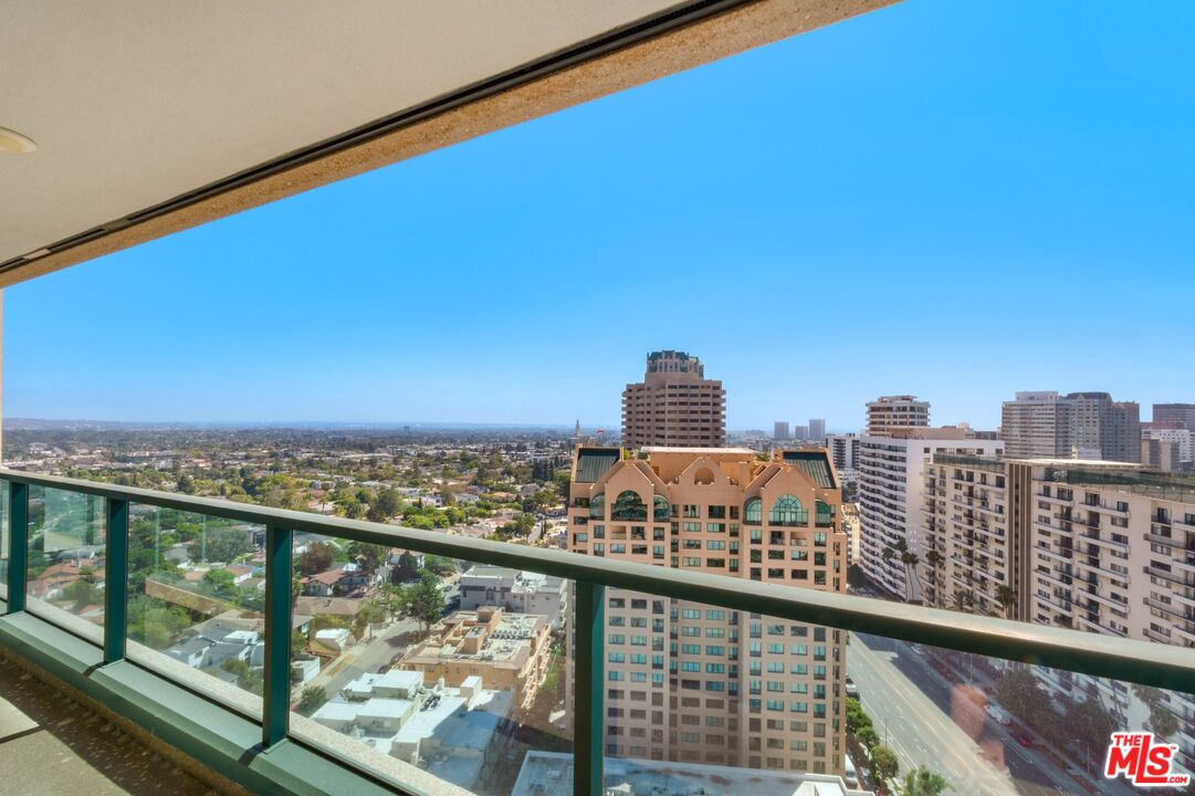 a view of a city skyline from a balcony