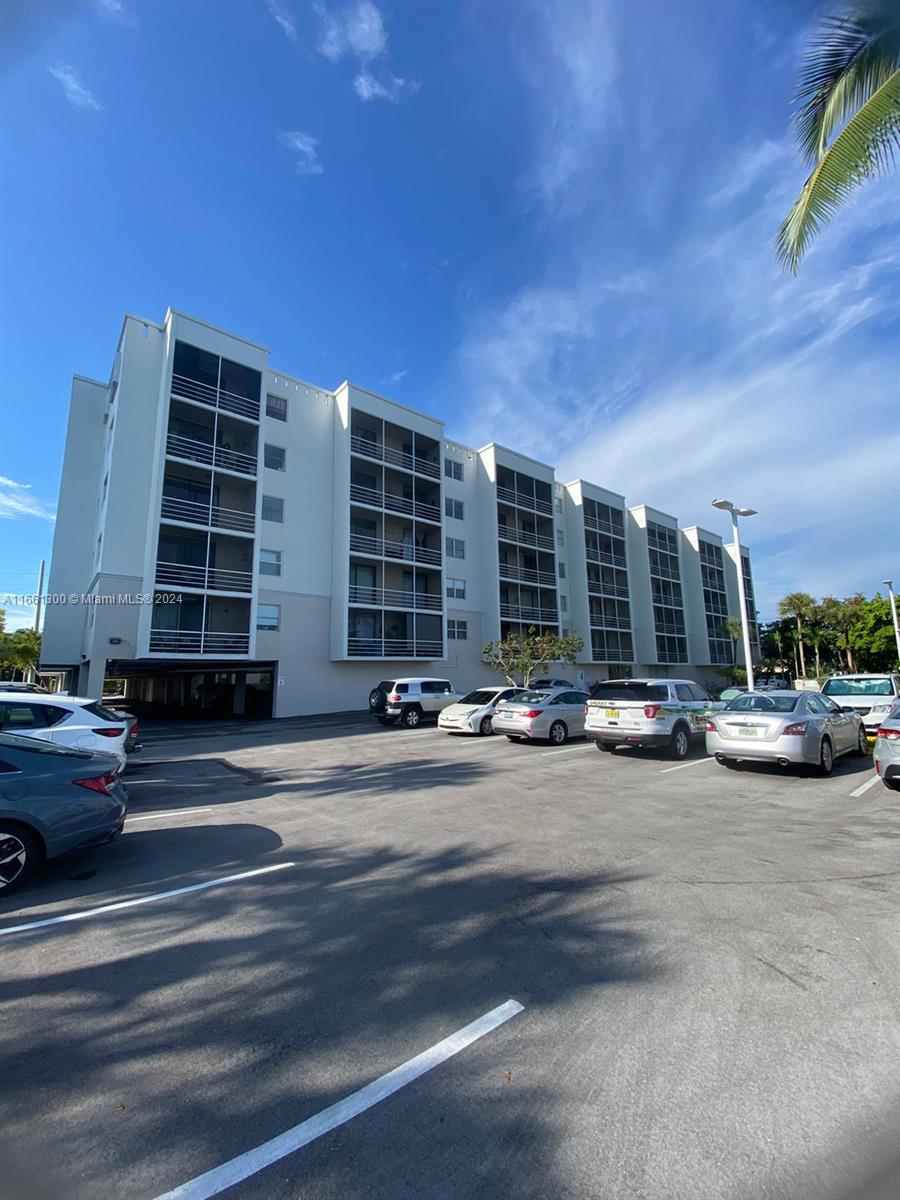 a view of a building and car parked