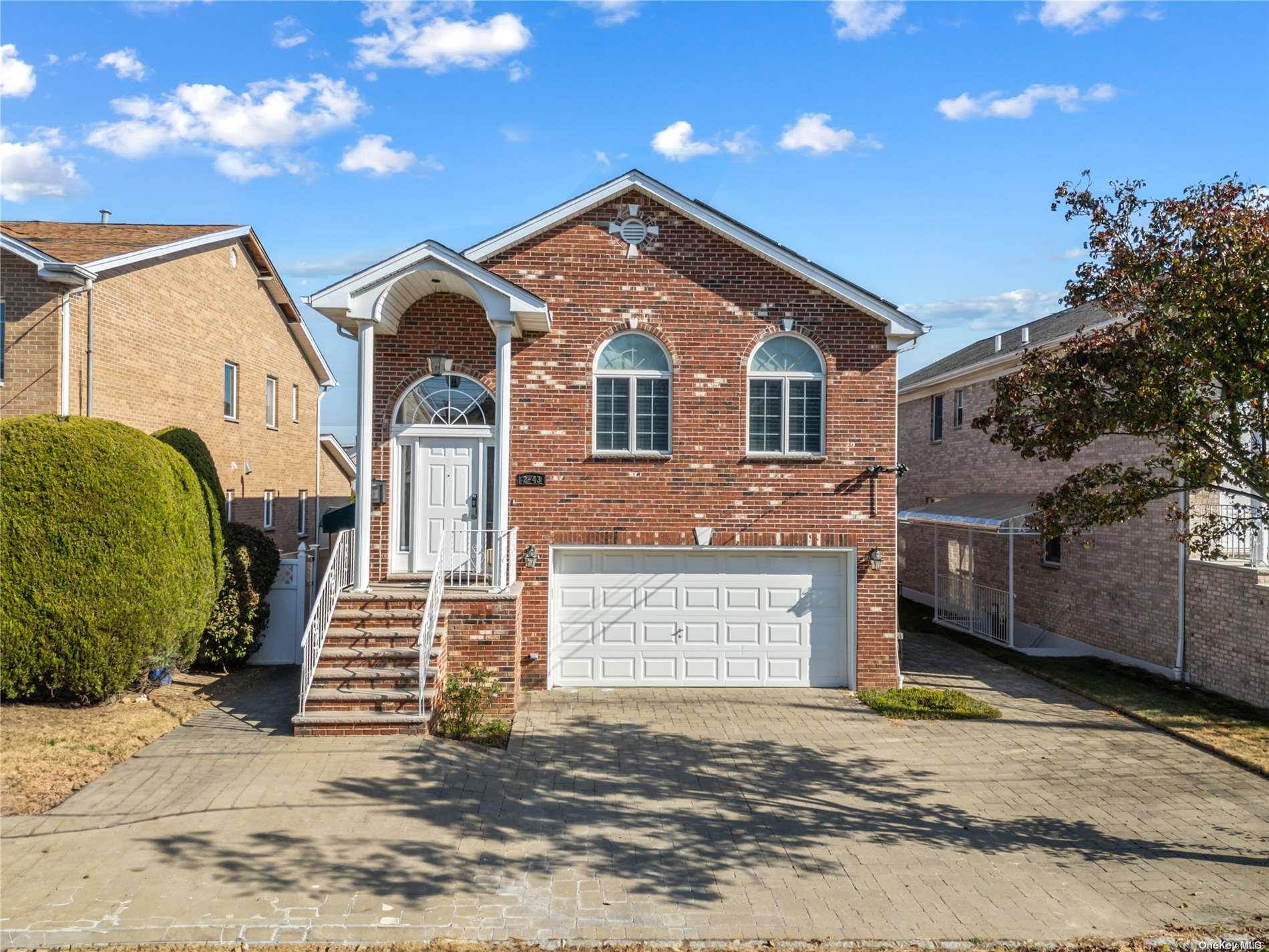 a front view of a house with a garage