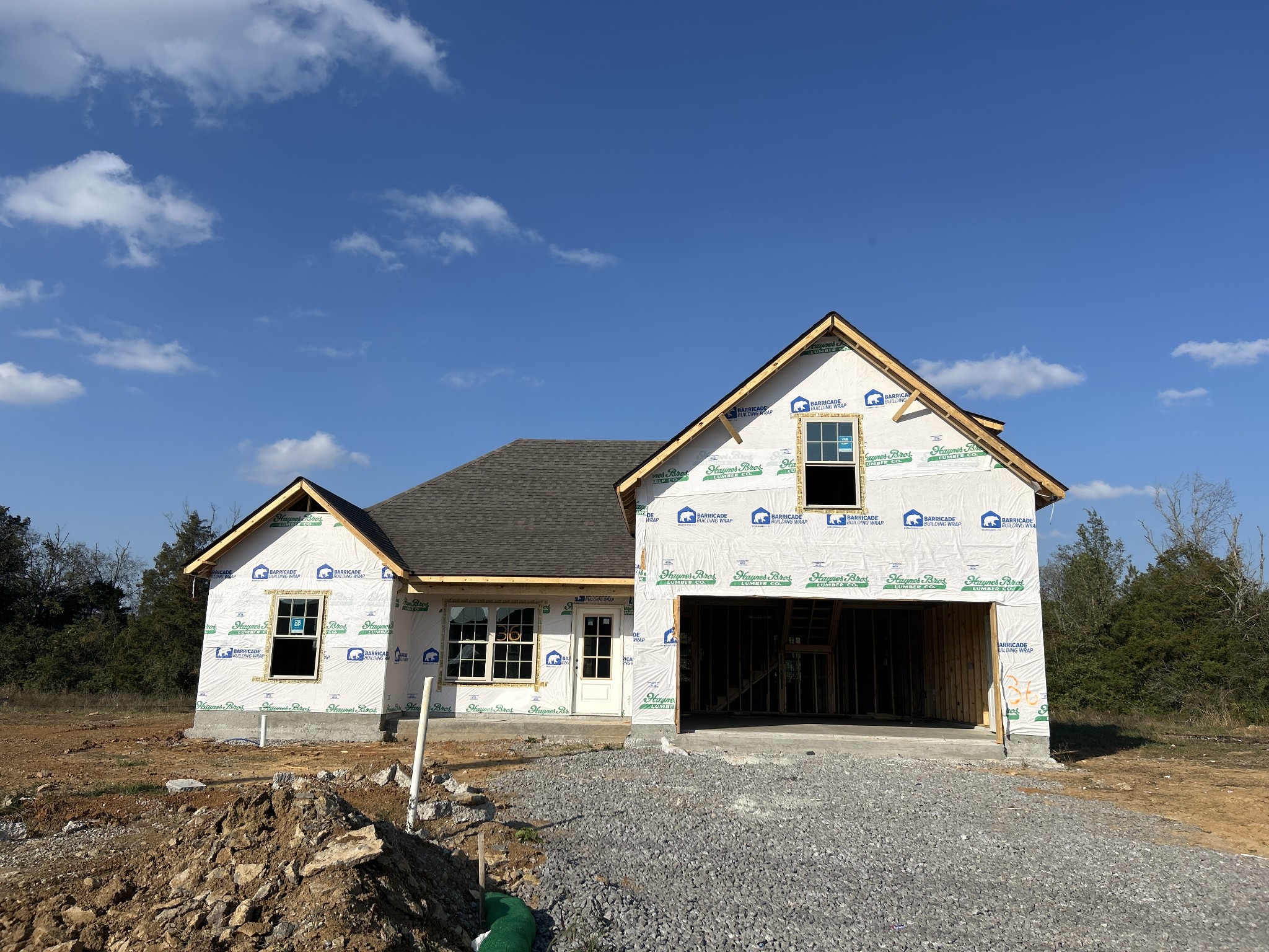 a front view of a house with yard