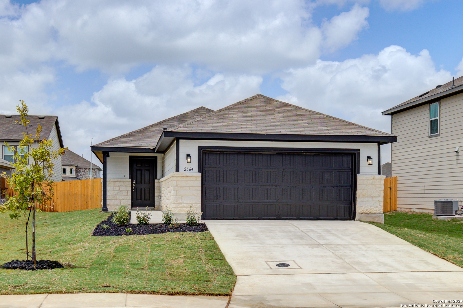 a front view of a house with garden