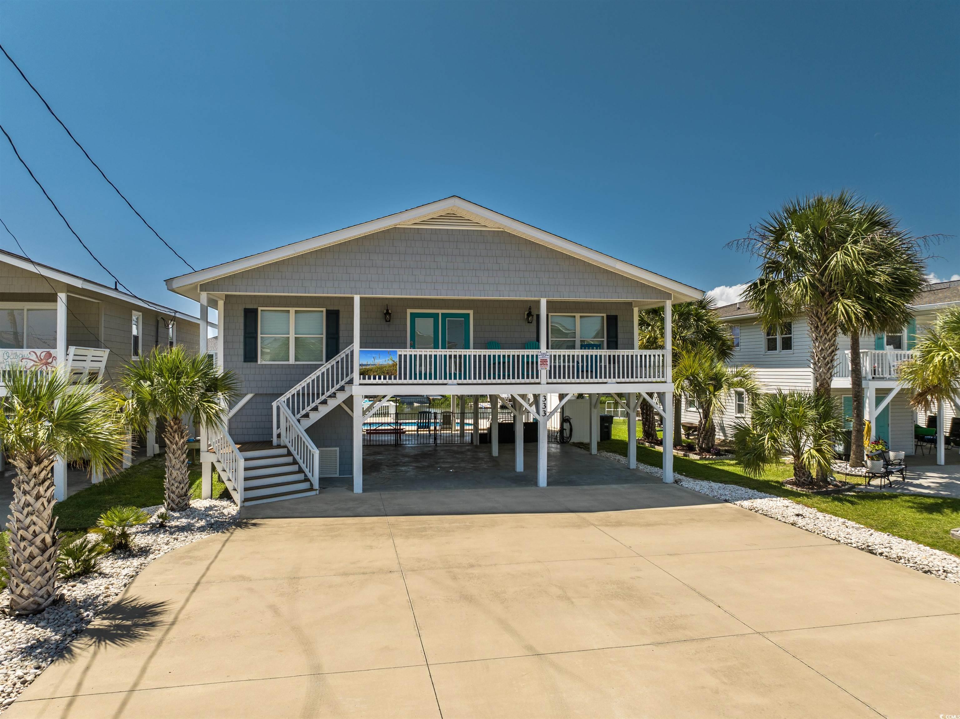 View of front of house with a carport