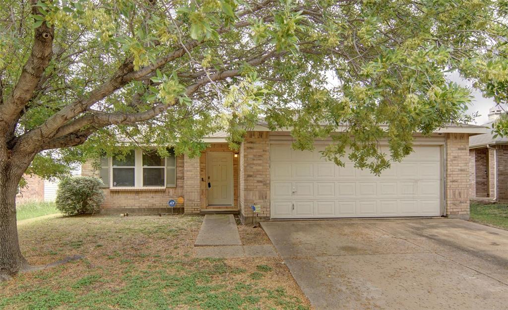 front view of house with a trees