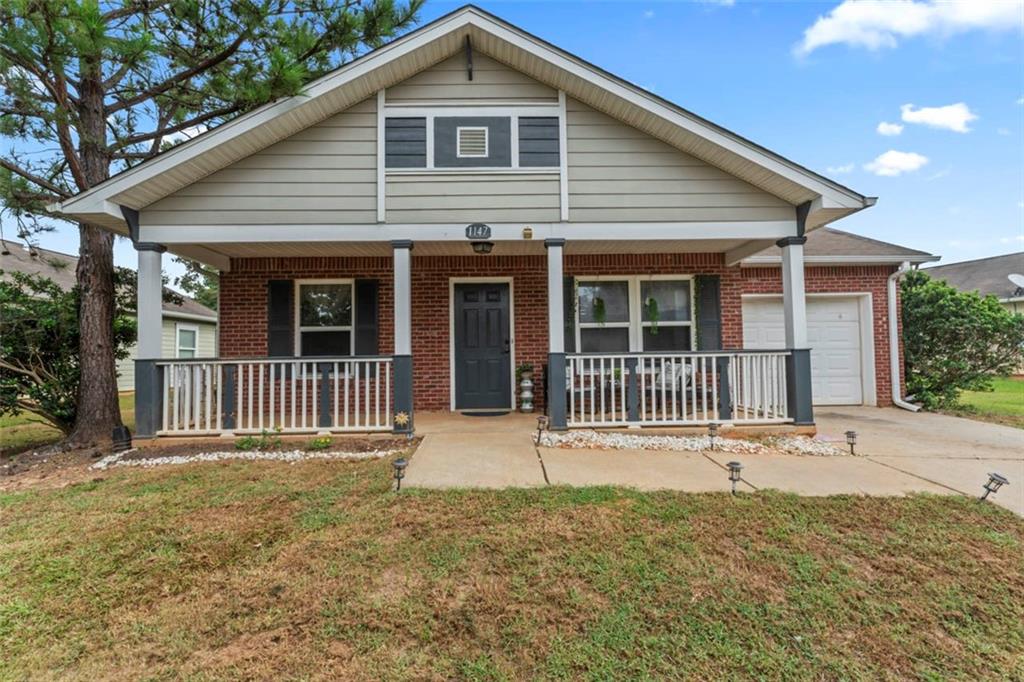 a front view of a house with a porch