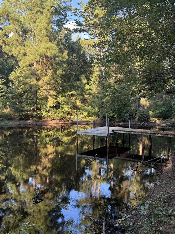 a view of a lake with sitting area