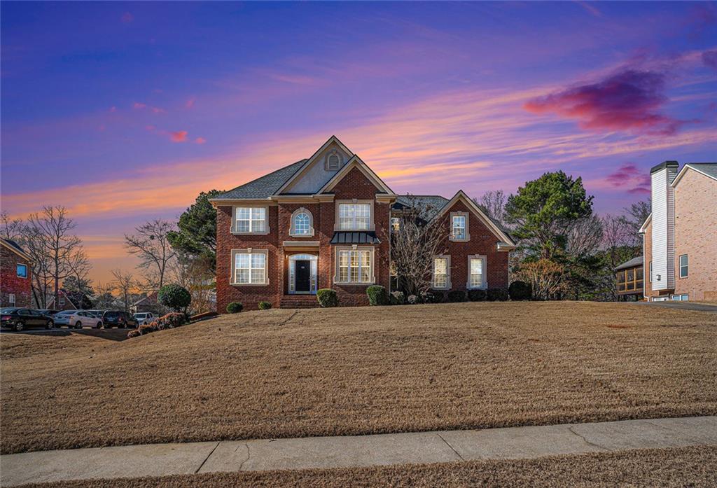 a front view of a house with a yard