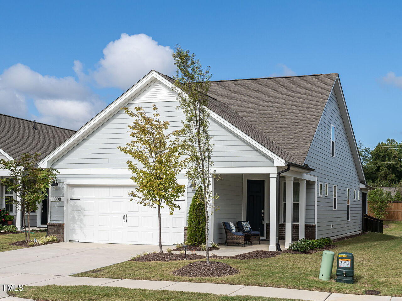 a view of a house with a yard and plants