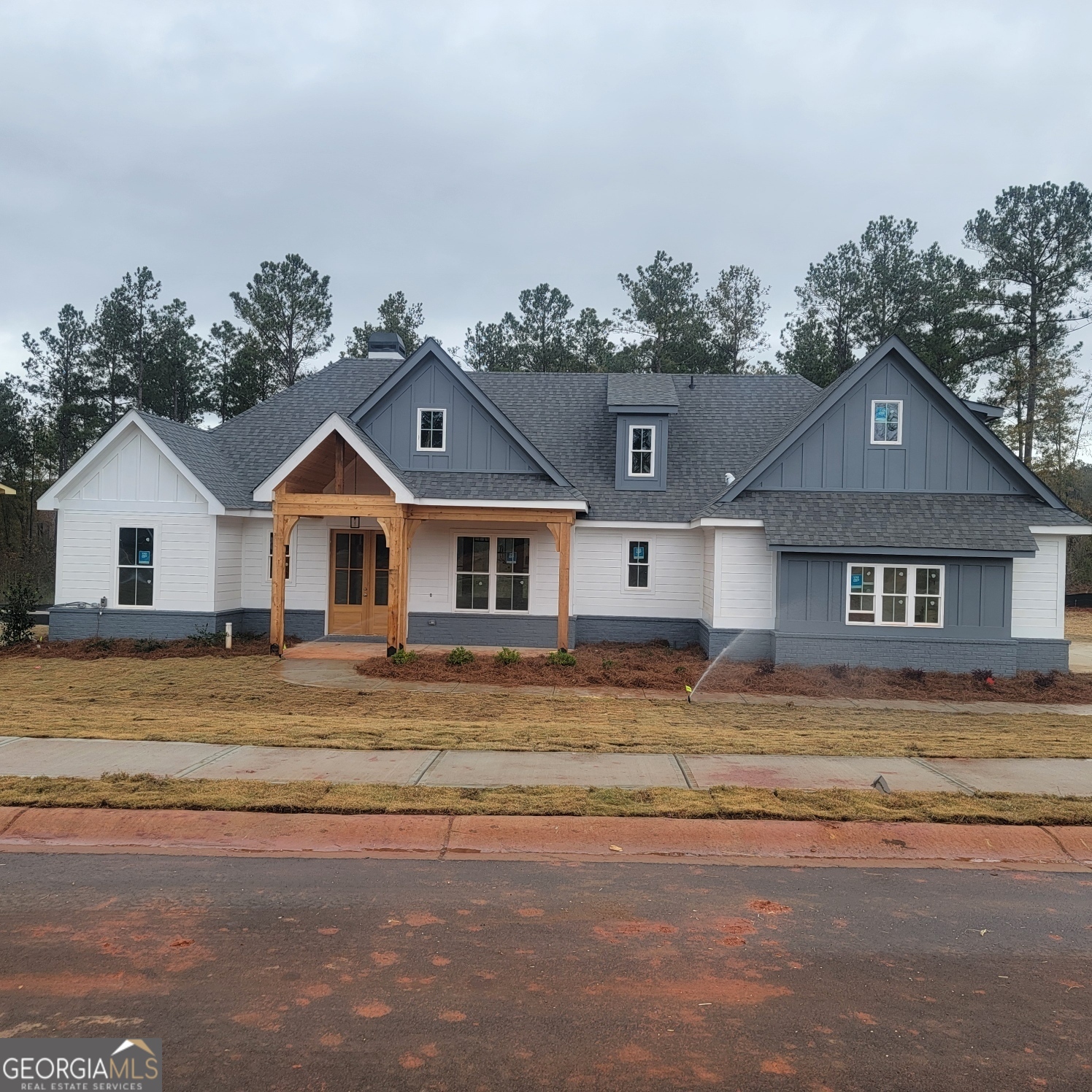 a front view of a house with a yard