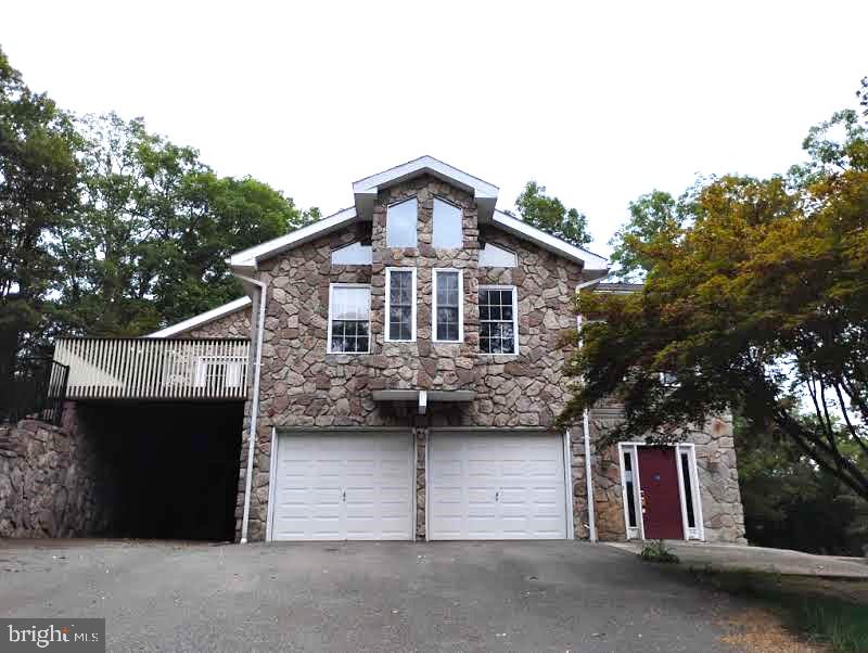 a front view of a house with a garage