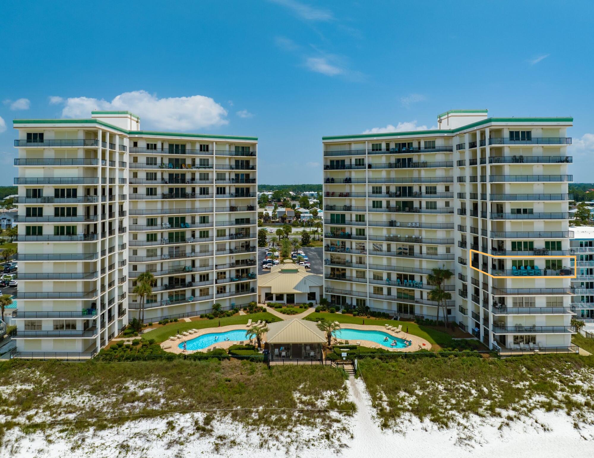 a view of building with swimming pool and outdoor space