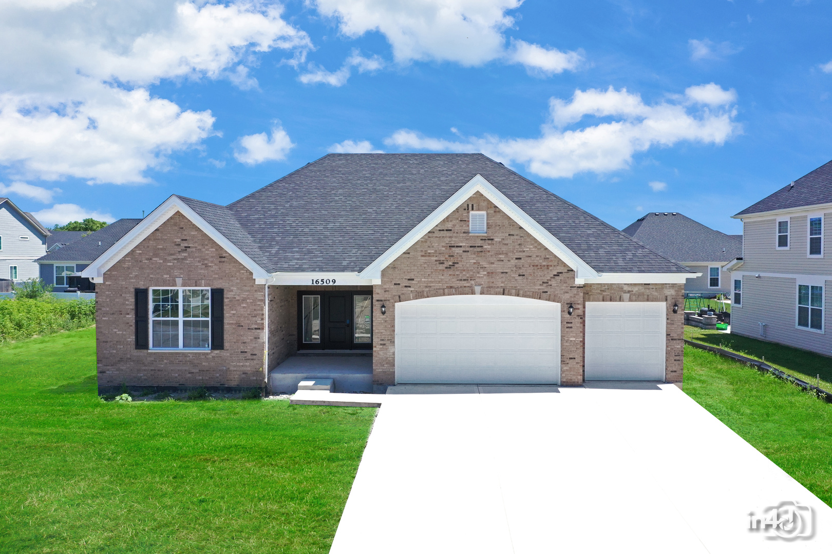 front view of a house with a yard