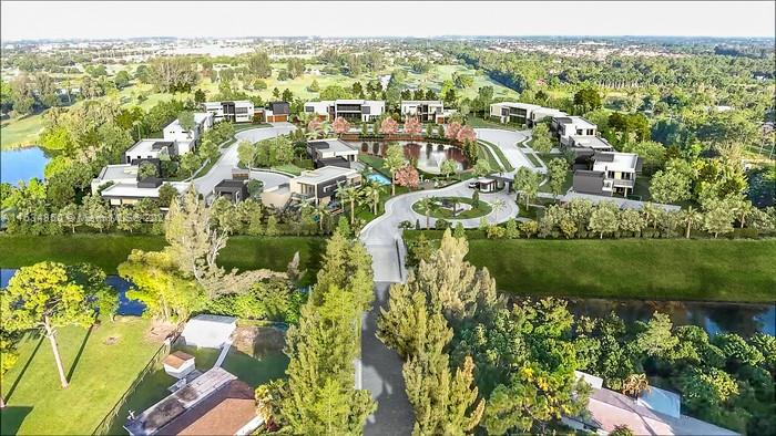 an aerial view of residential houses with outdoor space