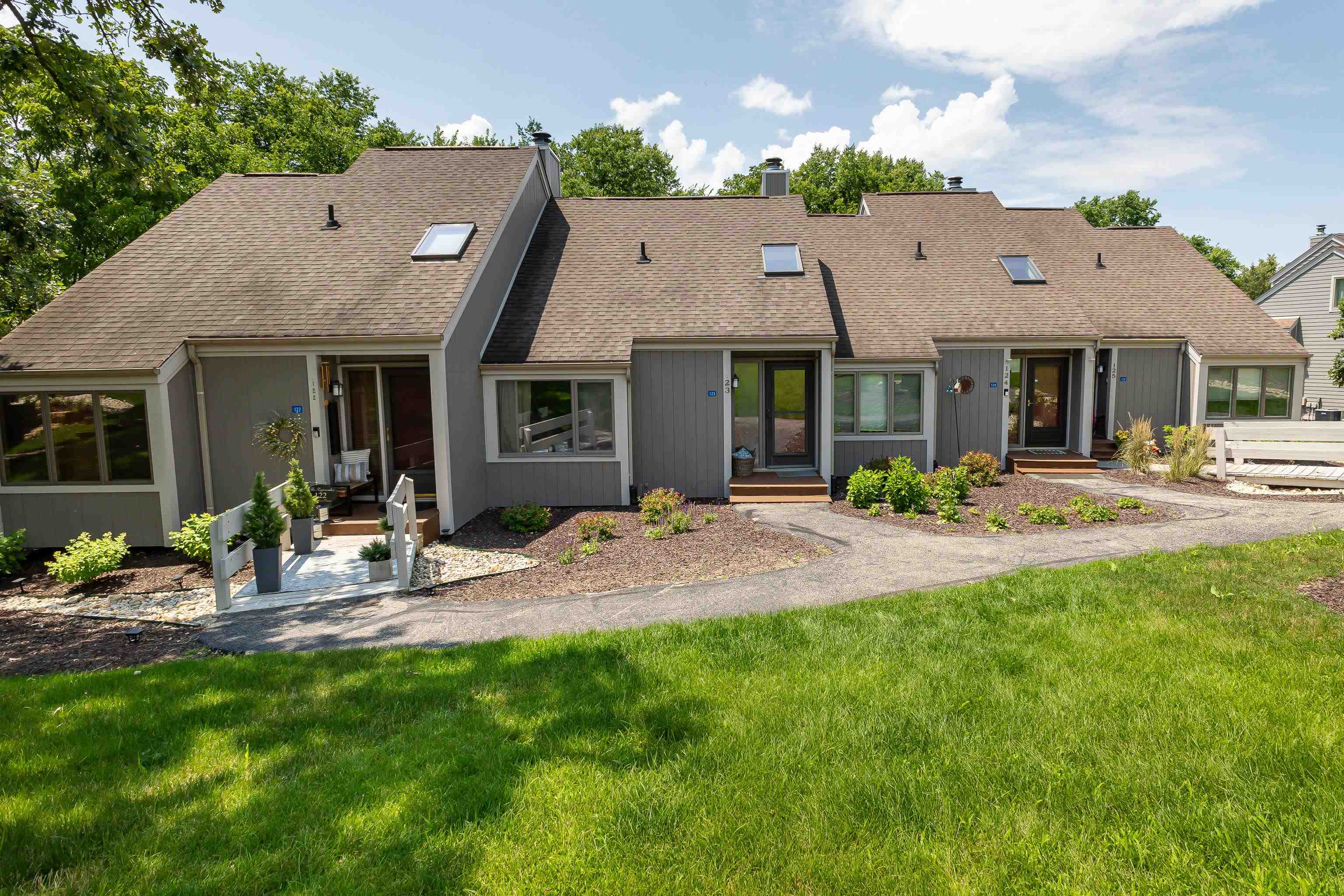 a view of a house with sitting area and garden