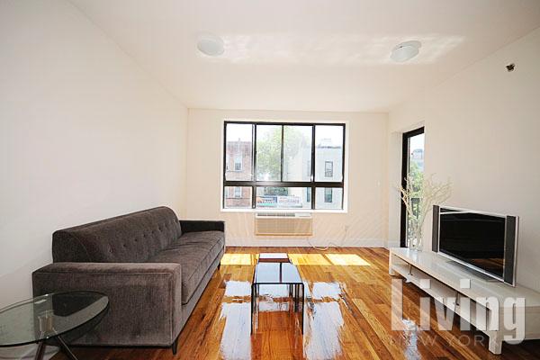 a living room with a couch and a flat screen tv