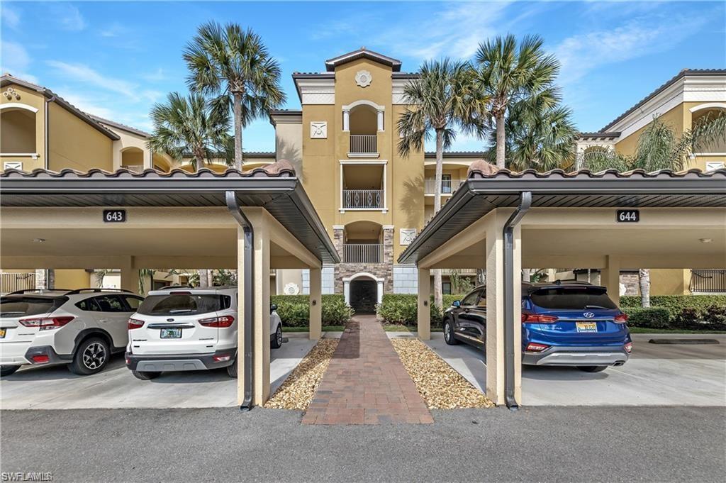 a view of a car park in front of house