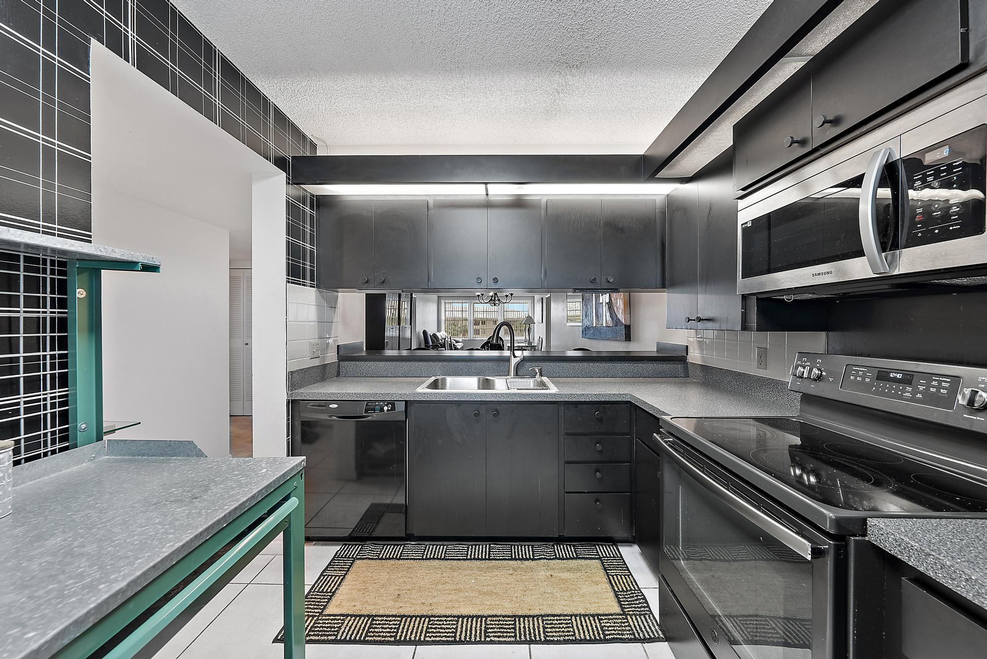 a kitchen with a stove and a sink