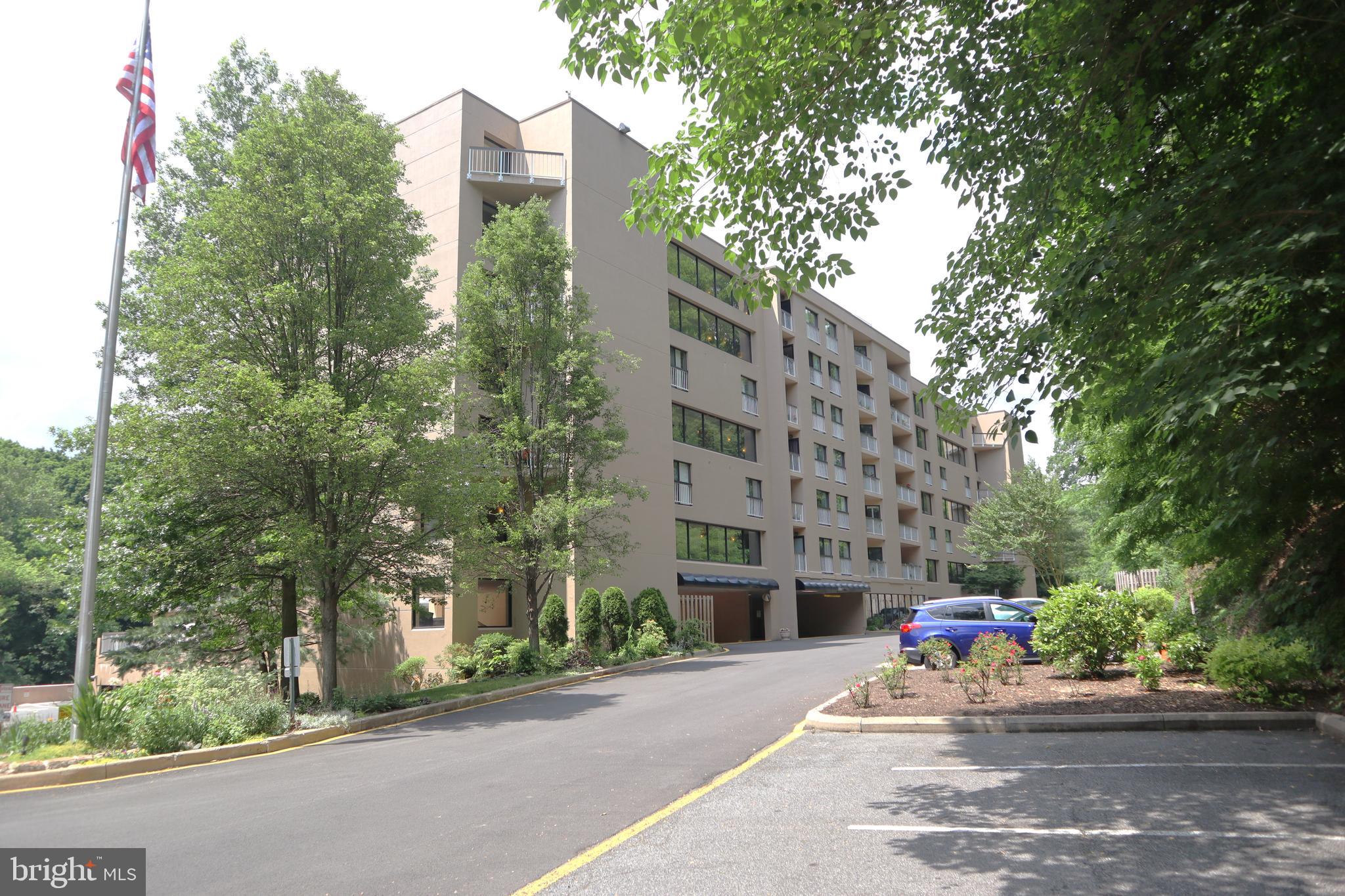 a building exterior with stairs and trees