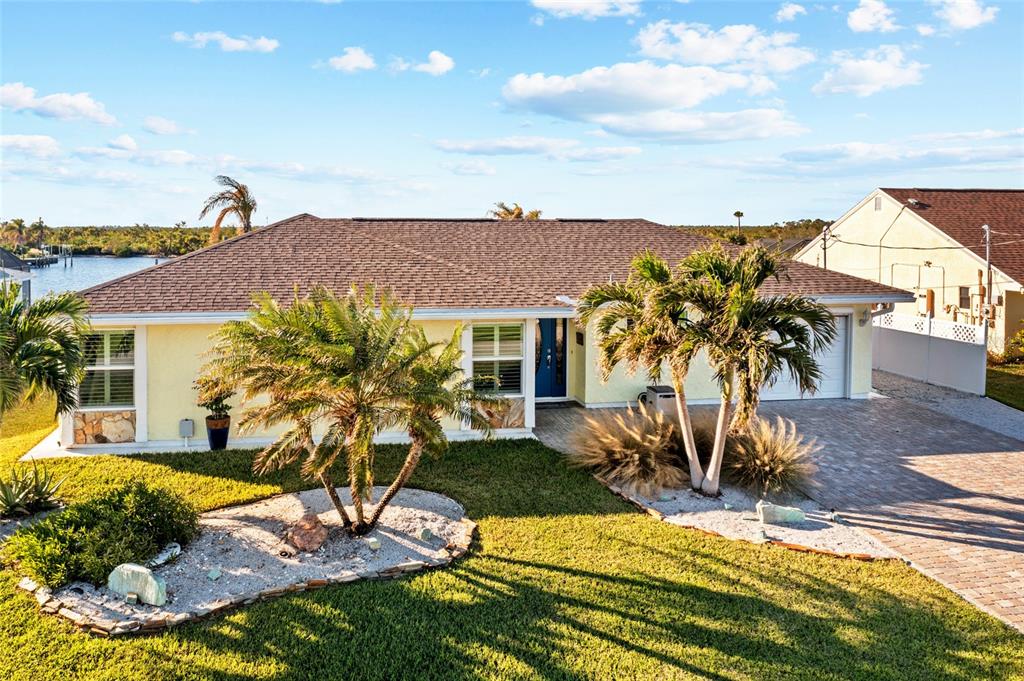 a view of a house with backyard outdoor seating area and barbeque oven