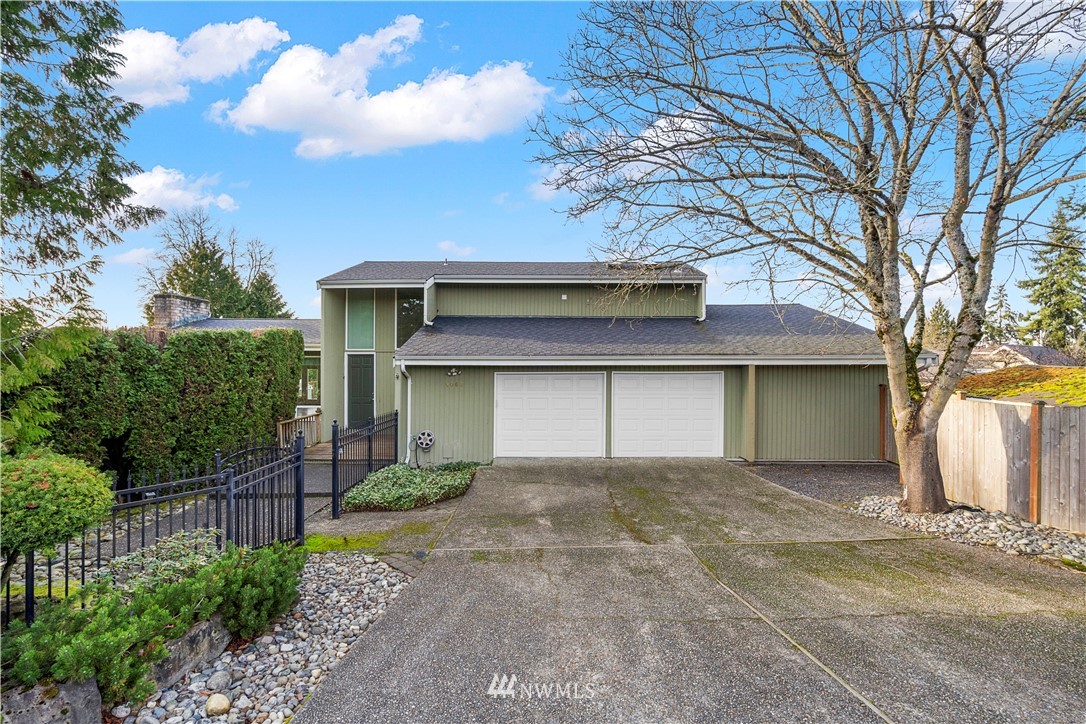 a front view of a house with a garage