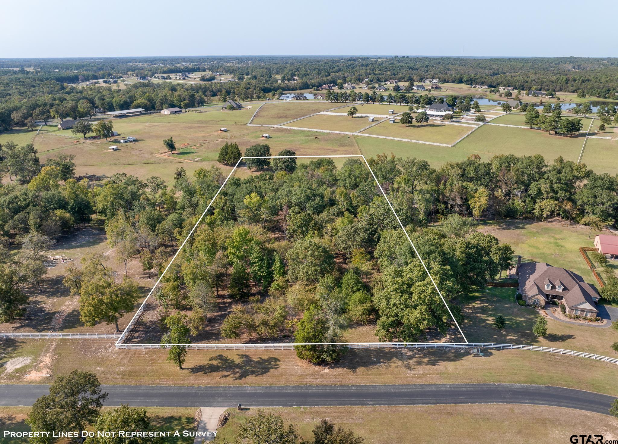 an aerial view of a houses with outdoor space and river