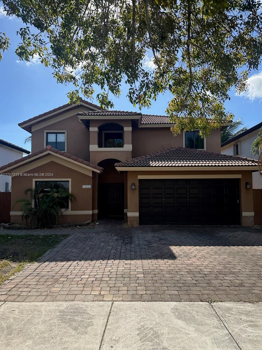 a front view of a house with a garage